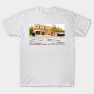 Route 66 sign on road in Winslow Arizona T-Shirt